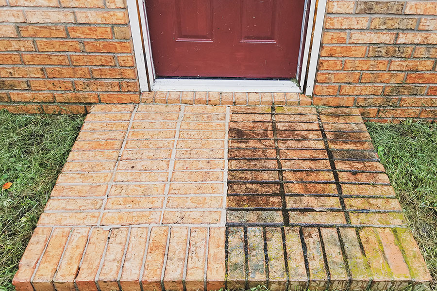 An example of brick before and after a proper power washing service. You can see the improvement in this Springfield, IL residence.