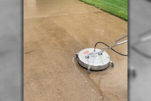 Professional power washing services being carefully administered to the concrete walkway of this Springfield, IL home.
