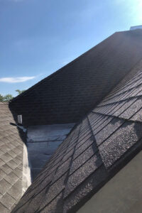 An asphalt roof in Springfield, IL that has been power washed by a professional power washing company for routine maintenance.