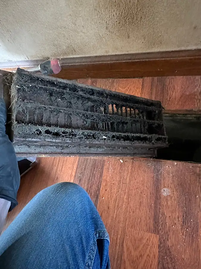Petersburg Power Washing - household vent lifted to reveal filthy air ducts in need of cleaning - Springfield, IL