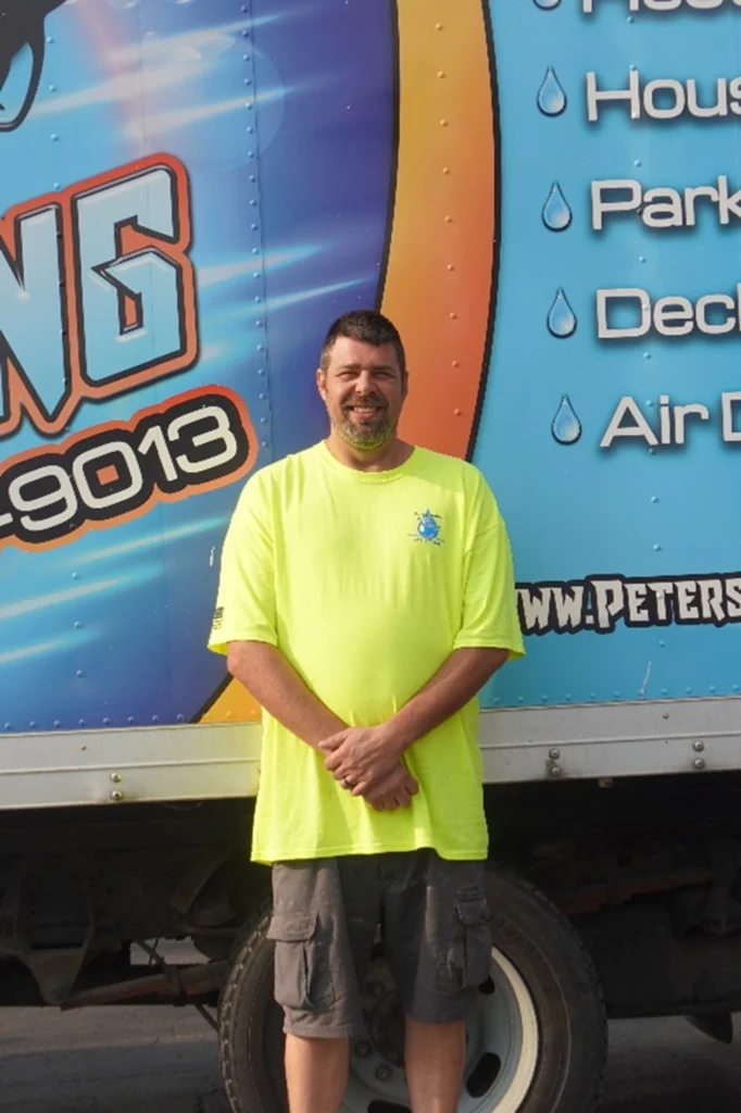 This is a photo of Petersburg Power Washing employee Phil Miller who manages the detail shop.