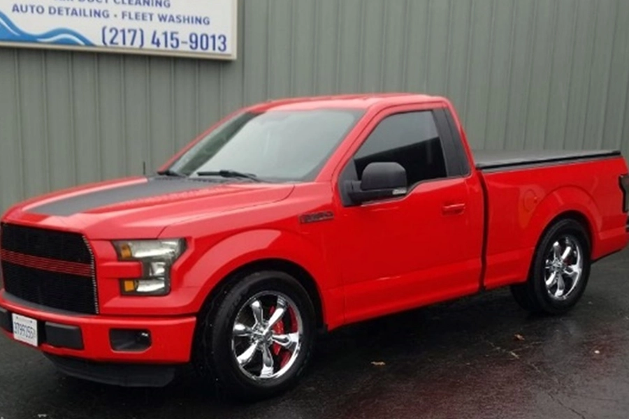 This is a photo of a red pickup truck that was freshly detailed.